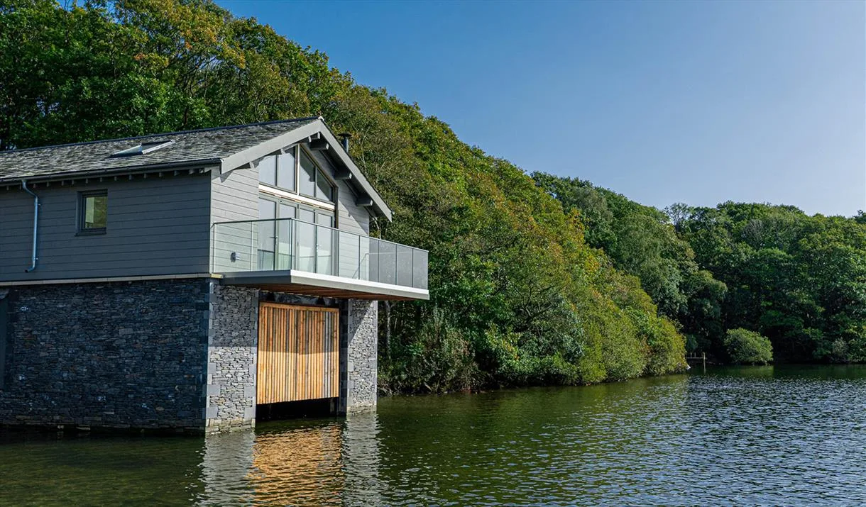 A quiet boathouse at the edge of a calm lake — the default help desk for lakes without a consultant