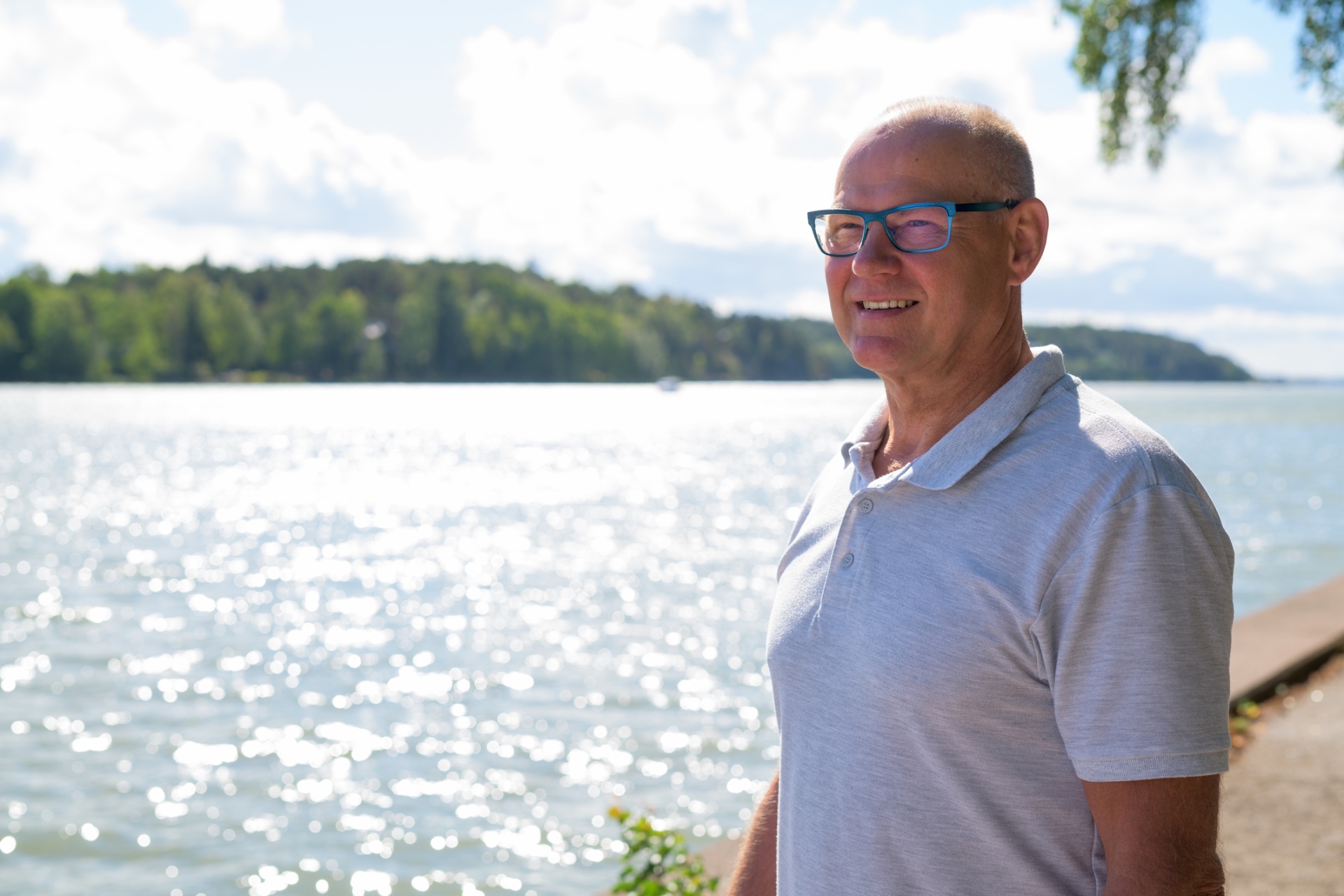 Lake Pulse advisor standing on a sunny lakeshore