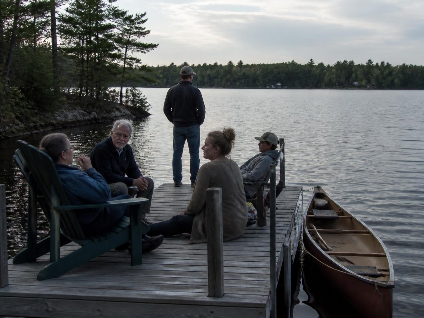 Lake neighbors gathered together on a dock